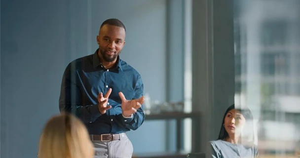 Man addressing colleagues