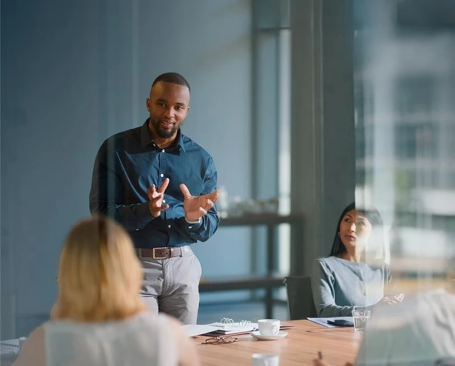 Man addressing colleagues