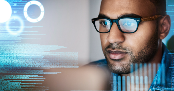 Man looking at computer with glasses