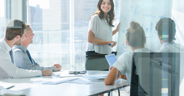 Meeting room setting with woman presenting