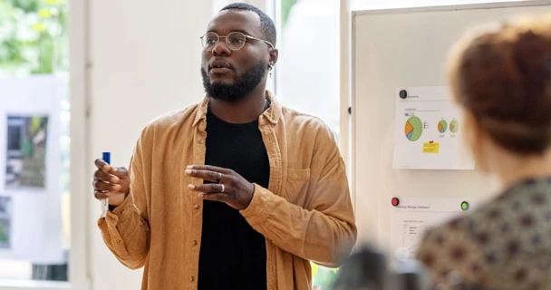 Man addressing colleagues