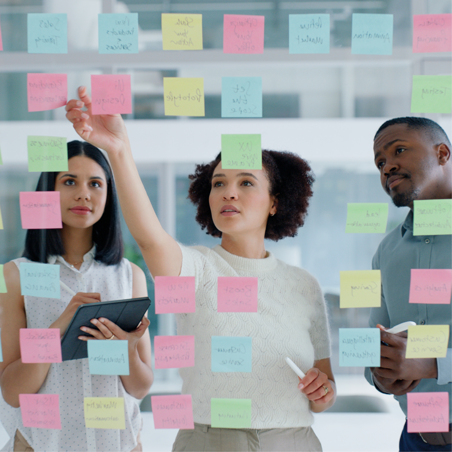 Workers in front of post-it notes