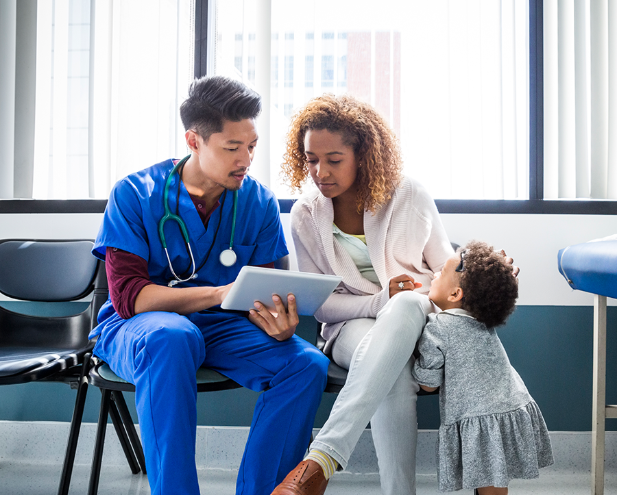 Doctor with woman and child