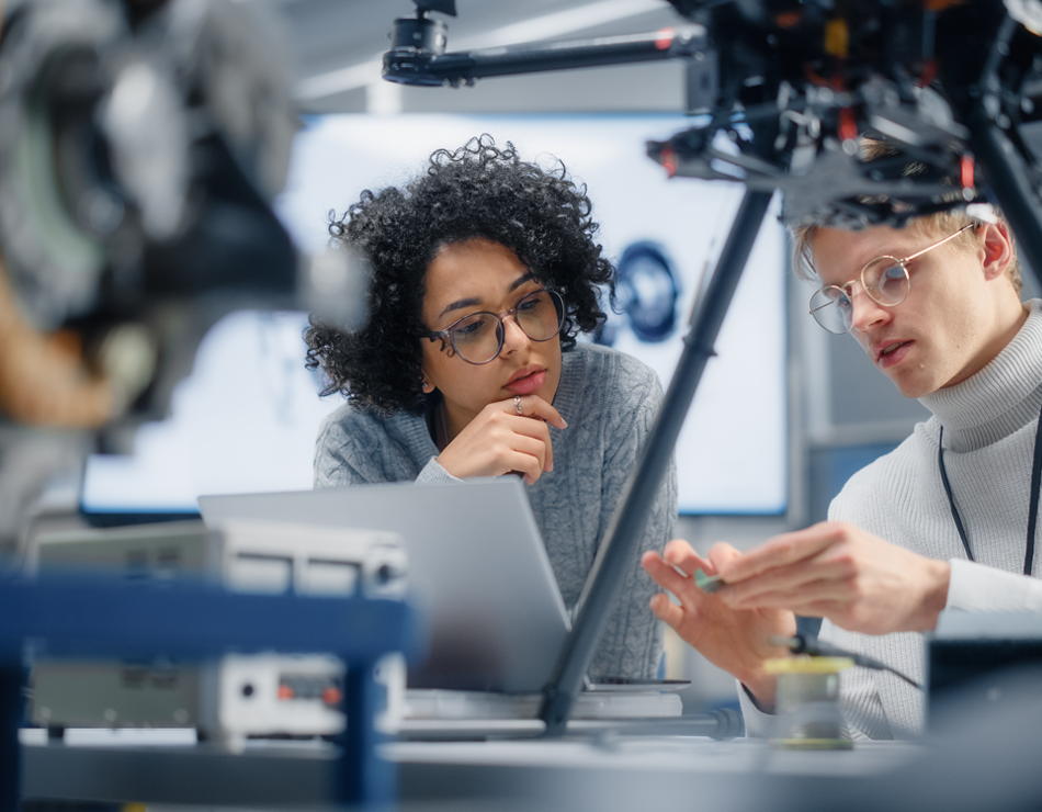 Man and woman on laptop in lab