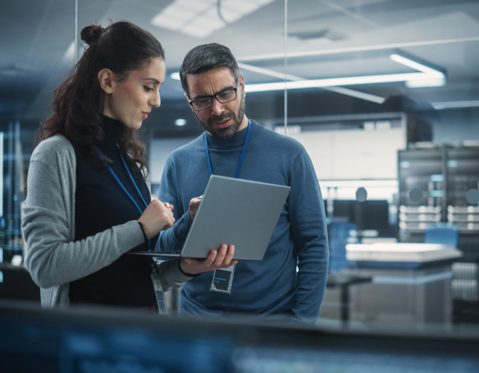 Man and woman on laptop in lab