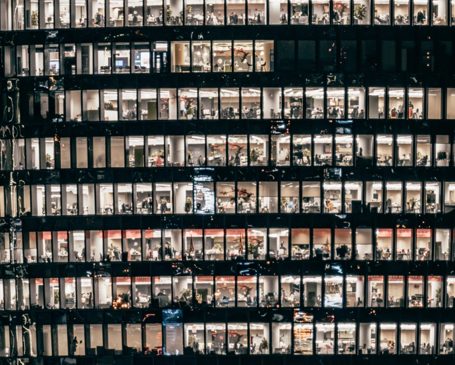 Image of busy office building with lights on