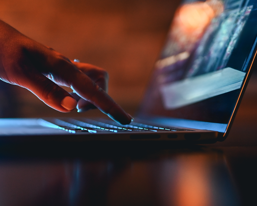Typing on laptop